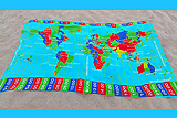 WorldTimeZone beach sarong kanga canga or beach towel displaying the World Time Zones map and time of the day in each time zone when it is 12 NOON at Greenwich.
